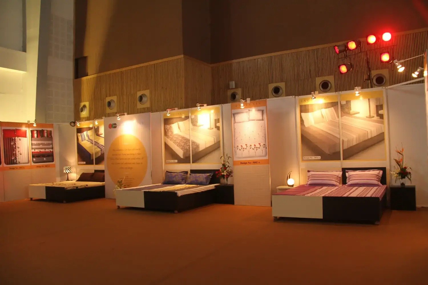 Man and woman speaking on stage at night with blue lighting